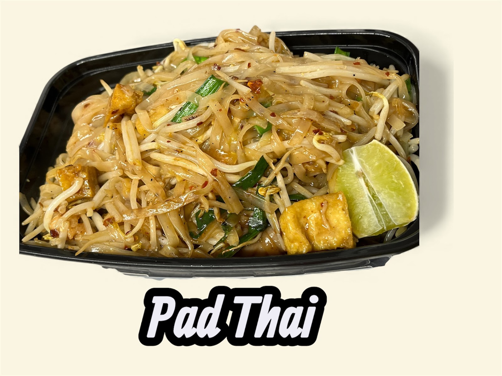 Pad Thai noodles with bean sprouts, tofu and a lime wedge