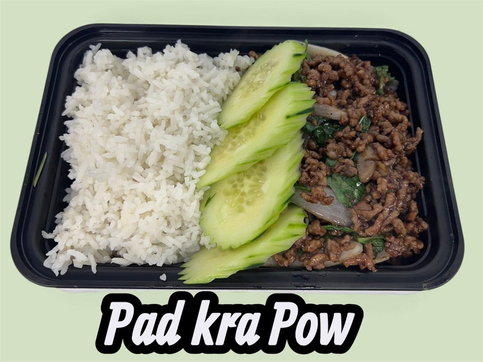 Pad Kra Pow with steamed rice and sliced cucumber